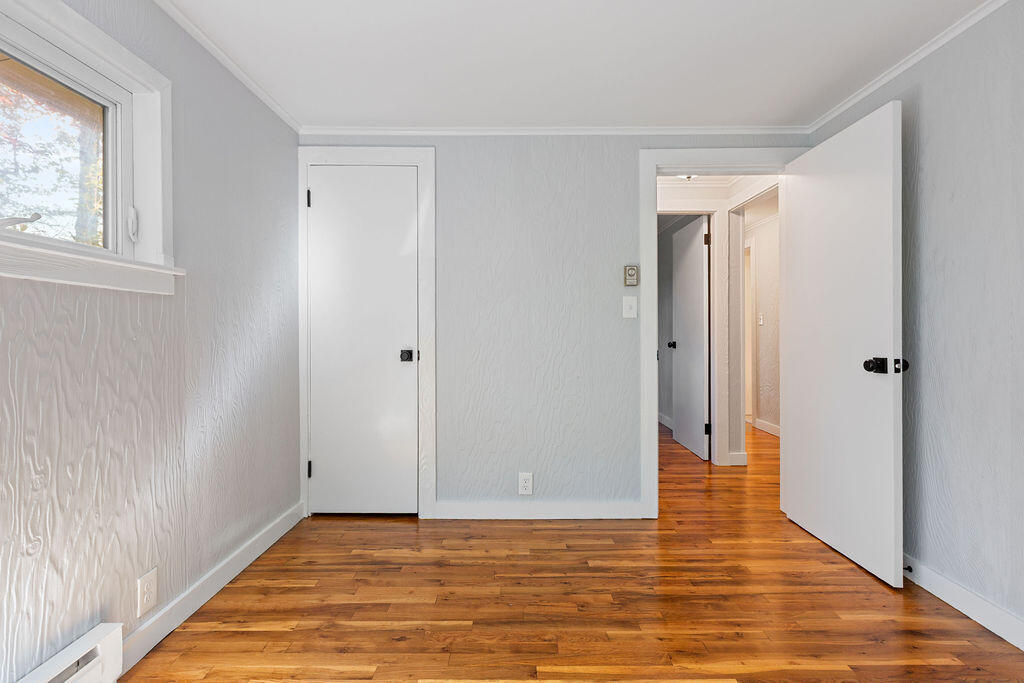 35 Santuit Lane Mashpee, MA 02649 - Photo 42 of 51 a view of an empty room with wooden floor and a bathroom
