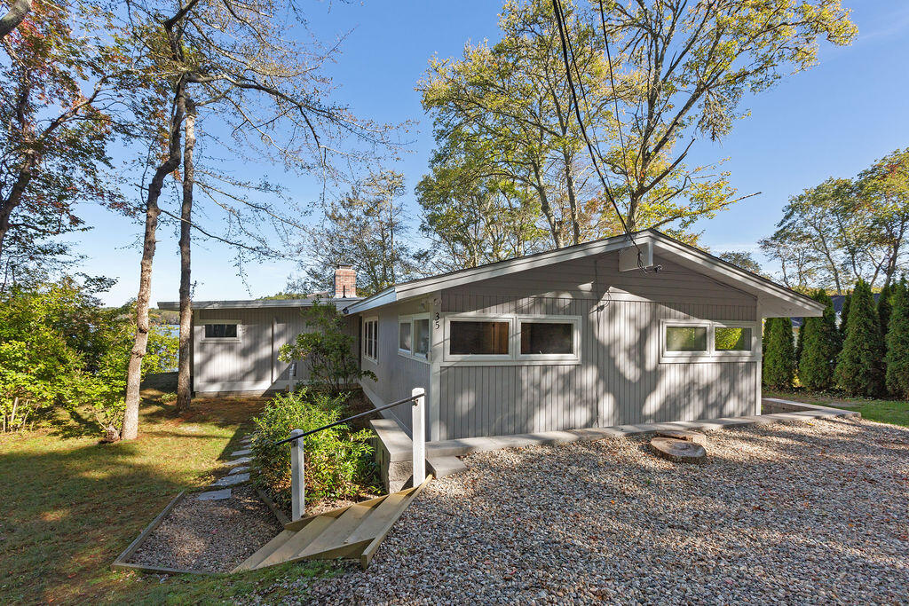 35 Santuit Lane Mashpee, MA 02649 - Photo 44 of 51 a view of a small house with a yard and large tree