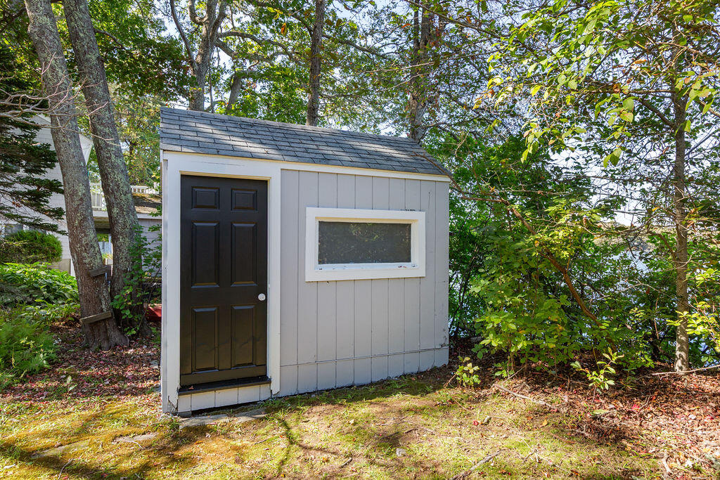 35 Santuit Lane Mashpee, MA 02649 - Photo 46 of 51 a backyard of a house with garage