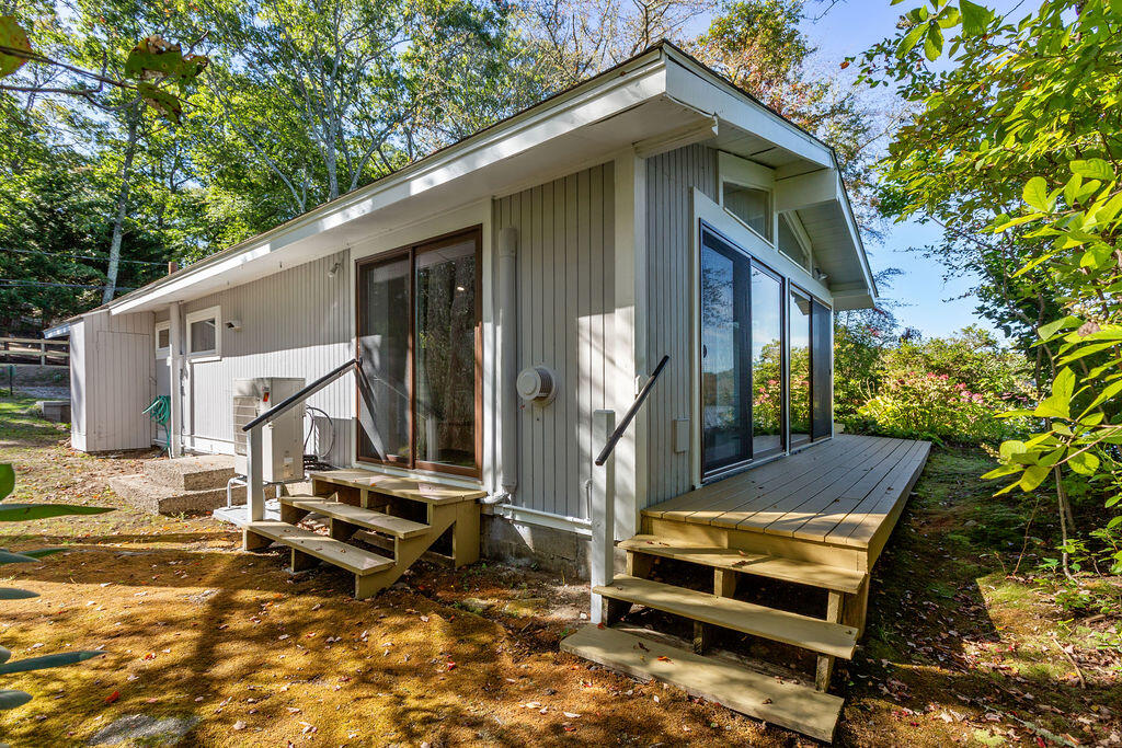 35 Santuit Lane Mashpee, MA 02649 - Photo 47 of 51 a front view of a house with garden