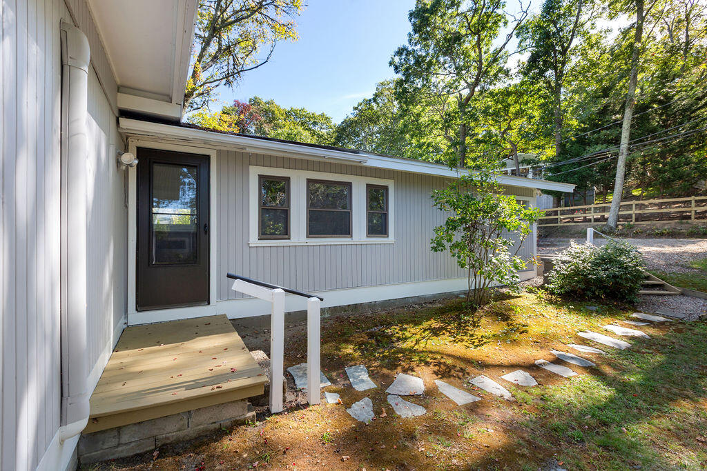 35 Santuit Lane Mashpee, MA 02649 - Photo 50 of 51 a view of backyard with a large tree