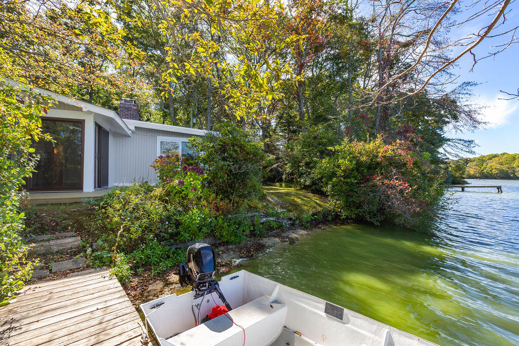 35 Santuit Lane Mashpee, MA 02649 - Photo 8 of 51 a view of backyard with outdoor seating and green space