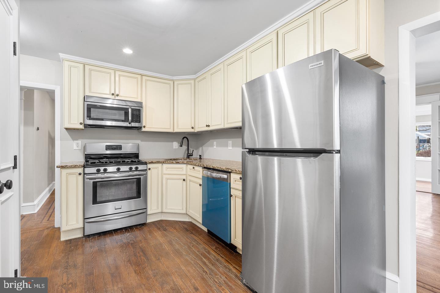 103 Llandaff Road Havertown, PA 19083 - Photo 11 of 36 a kitchen with stainless steel appliances a refrigerator sink and microwave