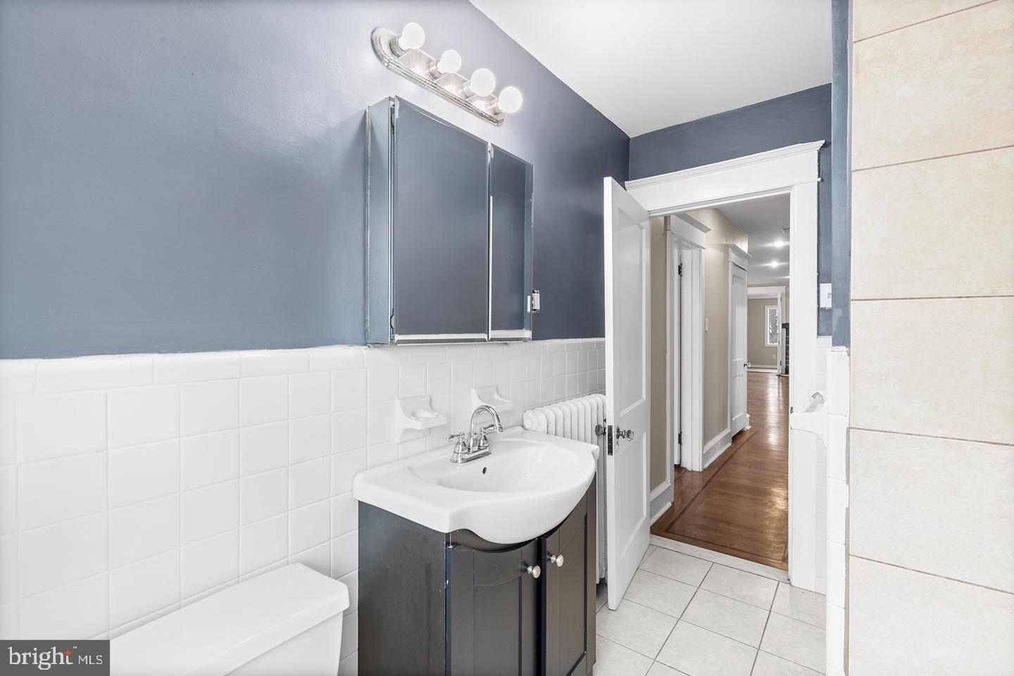 103 Llandaff Road Havertown, PA 19083 - Photo 13 of 36 a bathroom with a sink a toilet and mirror