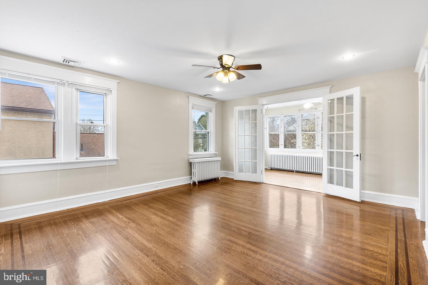 103 Llandaff Road Havertown, PA 19083 - Photo 20 of 36 a view of an empty room with a window and wooden floor