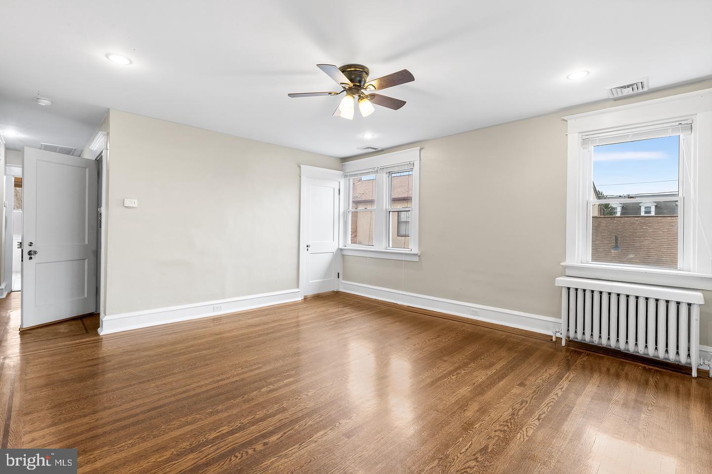 103 Llandaff Road Havertown, PA 19083 - Photo 21 of 36 a view of an empty room with wooden floor and a window