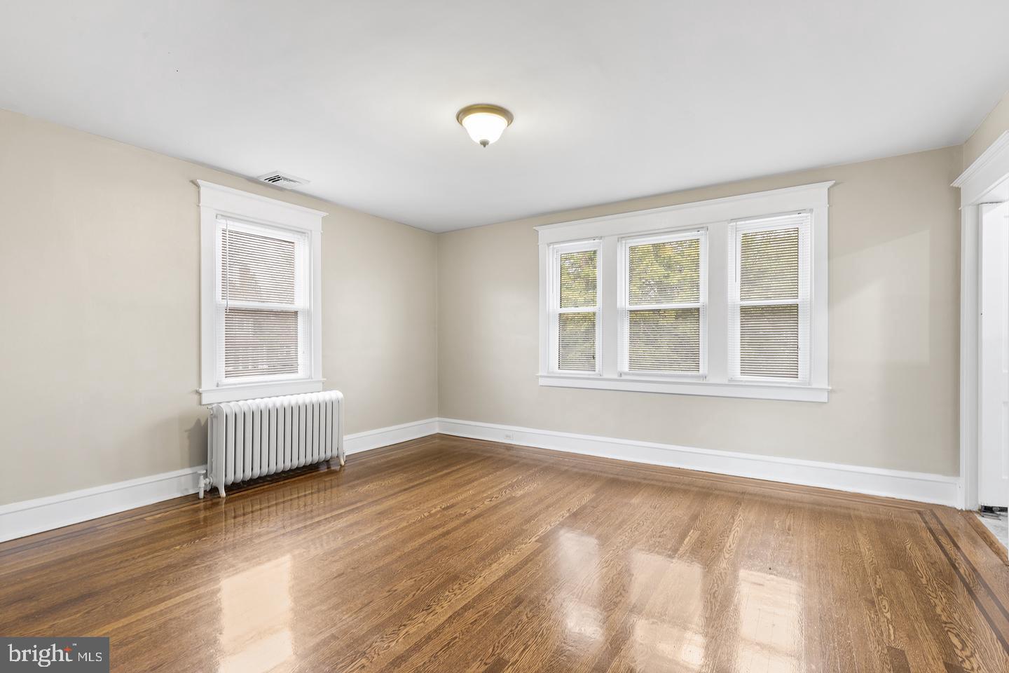 103 Llandaff Road Havertown, PA 19083 - Photo 23 of 36 a view of an empty room with wooden floor and a window