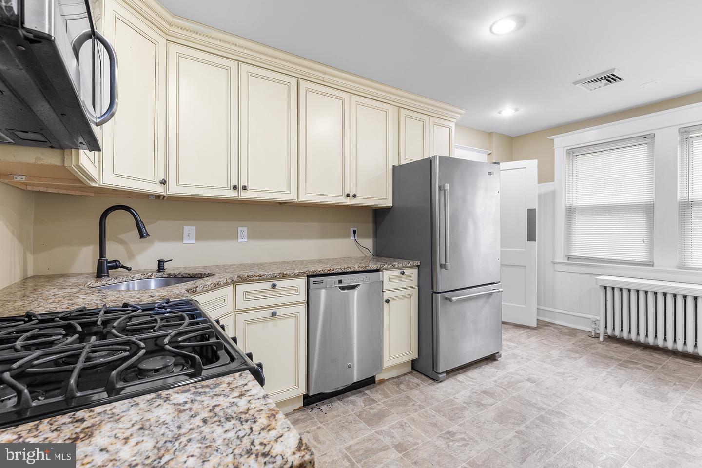 103 Llandaff Road Havertown, PA 19083 - Photo 24 of 36 a kitchen with stainless steel appliances granite countertop a stove a refrigerator and a refrigerator