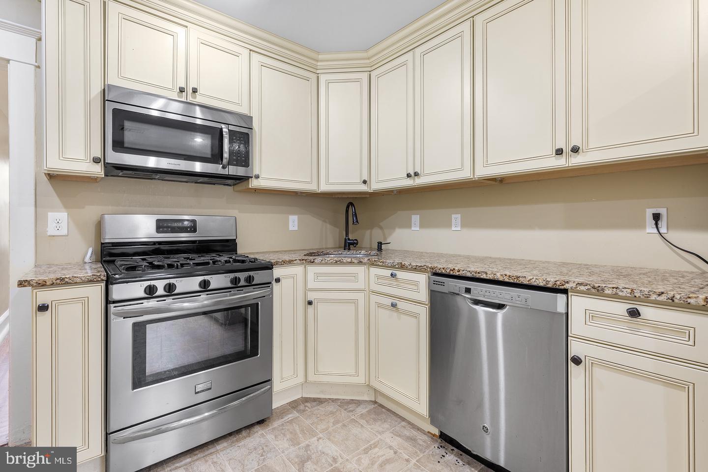 103 Llandaff Road Havertown, PA 19083 - Photo 25 of 36 a kitchen with appliances a sink and cabinets