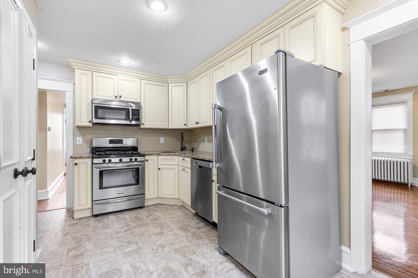 103 Llandaff Road Havertown, PA 19083 - Photo 26 of 36 a kitchen with stainless steel appliances a refrigerator stove and microwave