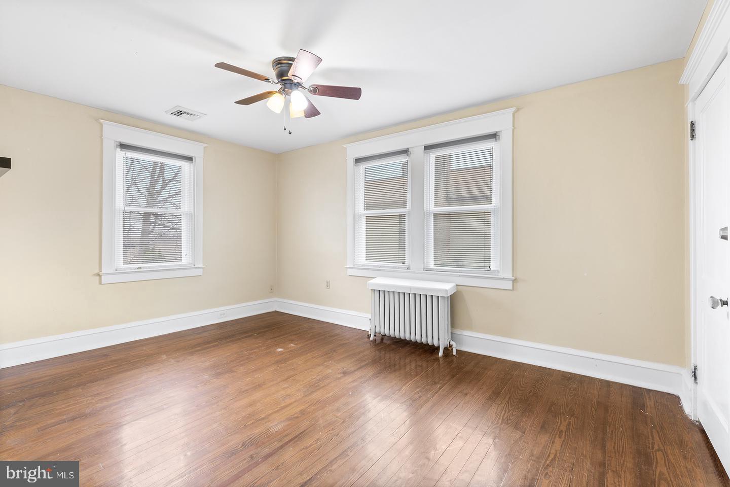 103 Llandaff Road Havertown, PA 19083 - Photo 27 of 36 a view of an empty room with wooden floor and a window