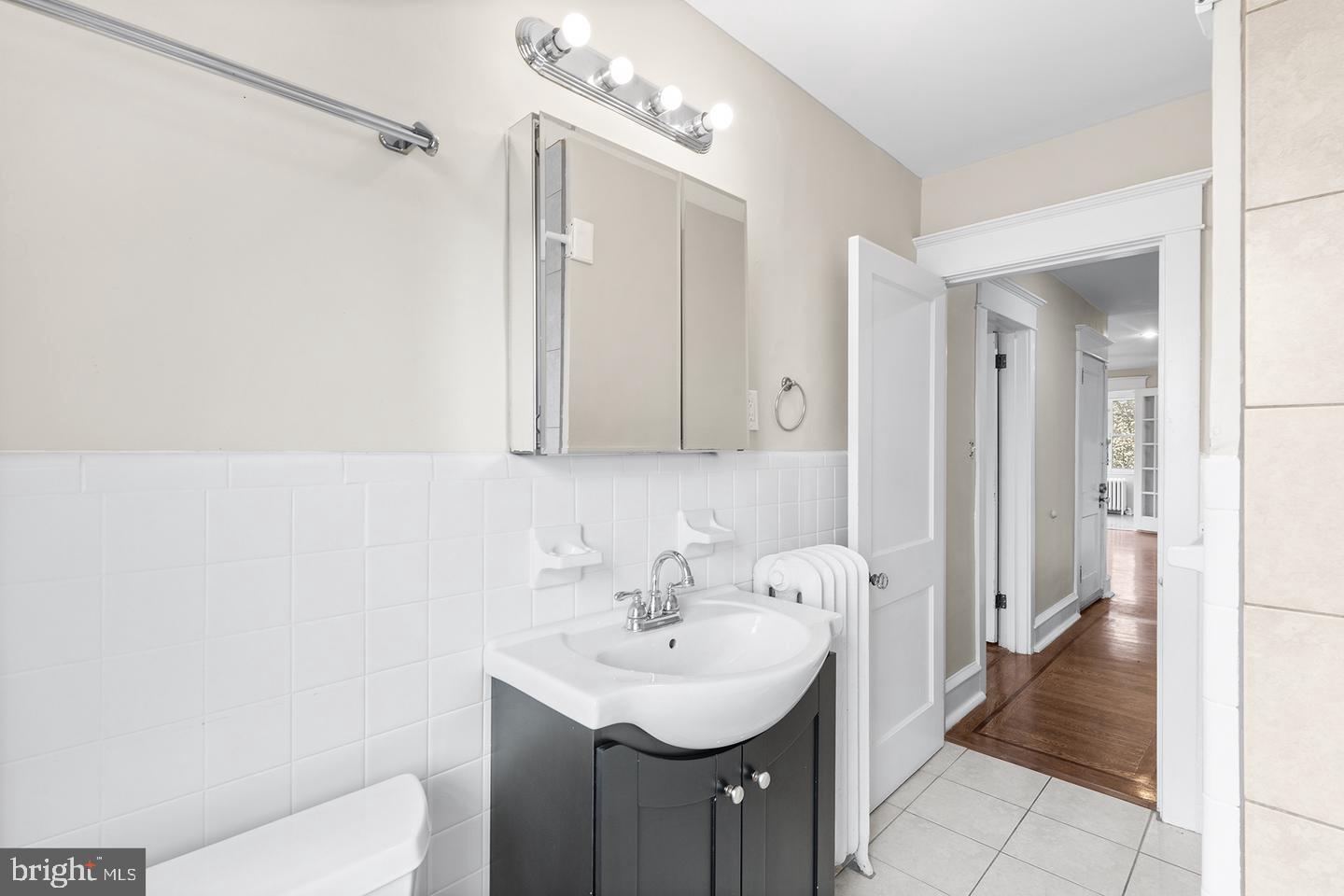 103 Llandaff Road Havertown, PA 19083 - Photo 28 of 36 a bathroom with a sink a toilet and shower