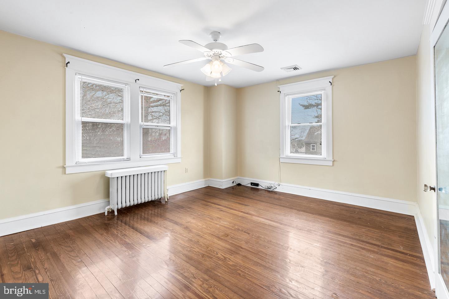 103 Llandaff Road Havertown, PA 19083 - Photo 29 of 36 a view of an empty room with a window and wooden floor
