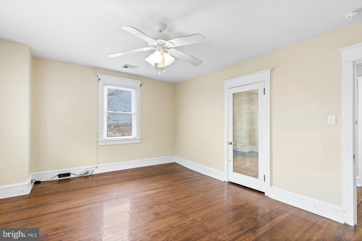 103 Llandaff Road Havertown, PA 19083 - Photo 30 of 36 an empty room with wooden floor fan and windows