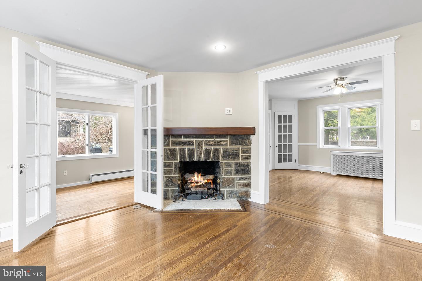 103 Llandaff Road Havertown, PA 19083 - Photo 5 of 36 an empty room with furniture and a fireplace
