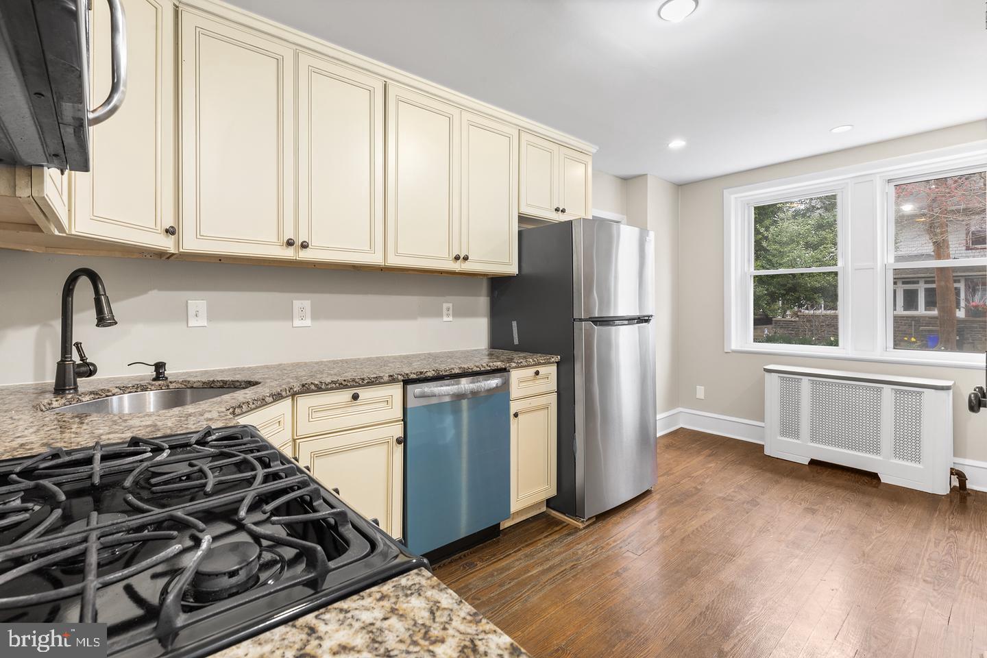103 Llandaff Road Havertown, PA 19083 - Photo 9 of 36 a kitchen with a stove a refrigerator and a sink