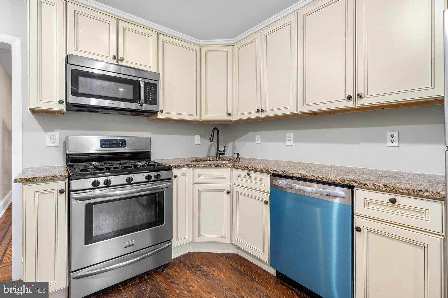 103 Llandaff Road Havertown, PA 19083 - Photo 10 of 36 a kitchen with white cabinets stainless steel appliances and sink