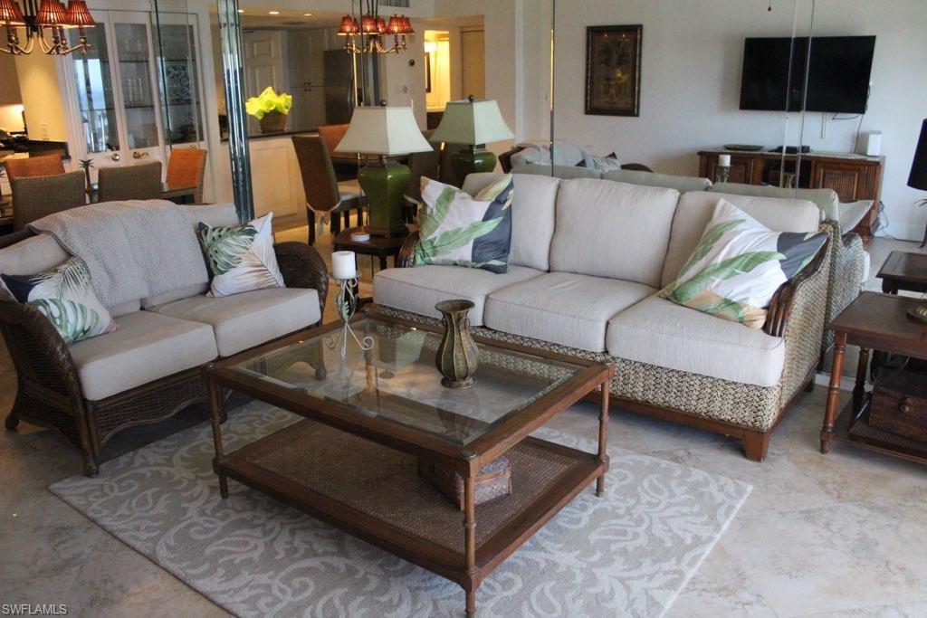 1 Bluebill Avenue, Unit 707 Naples, FL 34108 - Photo 14 of 16 Living room with a notable chandelier
