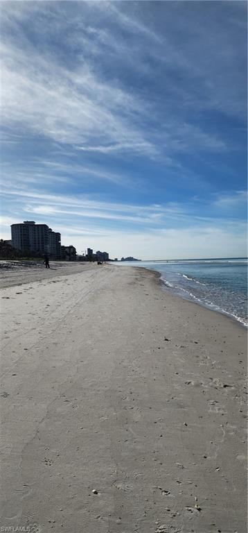 1 Bluebill Avenue, Unit 707 Naples, FL 34108 - Photo 6 of 16 View of water feature with a beach view