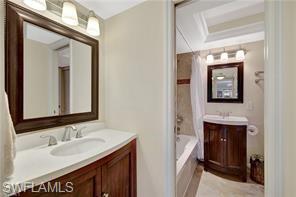 1 Bluebill Avenue, Unit 707 Naples, FL 34108 - Photo 8 of 16 Bathroom with vanity and tub / shower combination