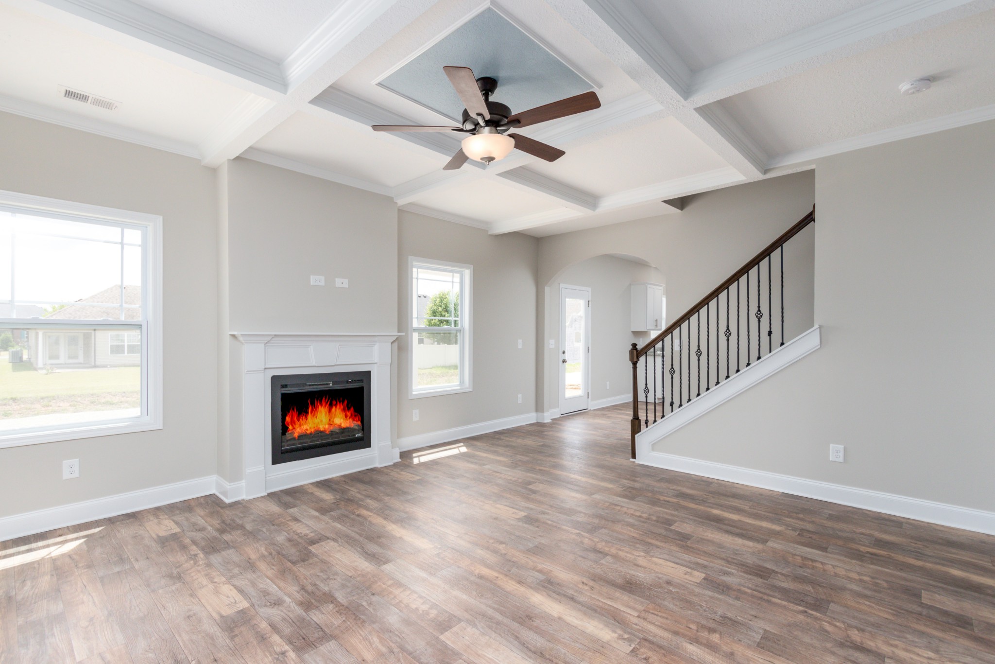 100 Murrell Road Dickson, TN 37055 - Photo 6 of 17 an empty room with windows fireplace and a ceiling fan