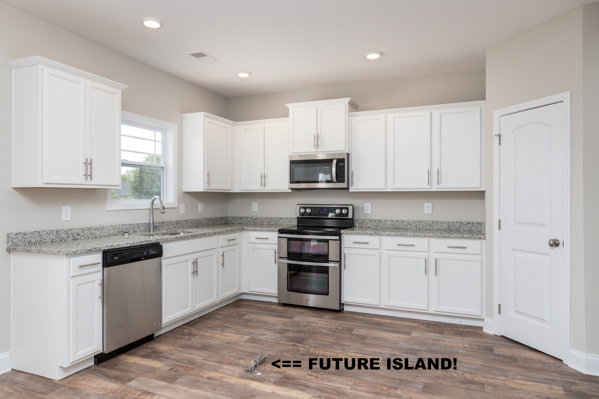 100 Murrell Road Dickson, TN 37055 - Photo 8 of 17 a kitchen with granite countertop white cabinets and stainless steel appliances