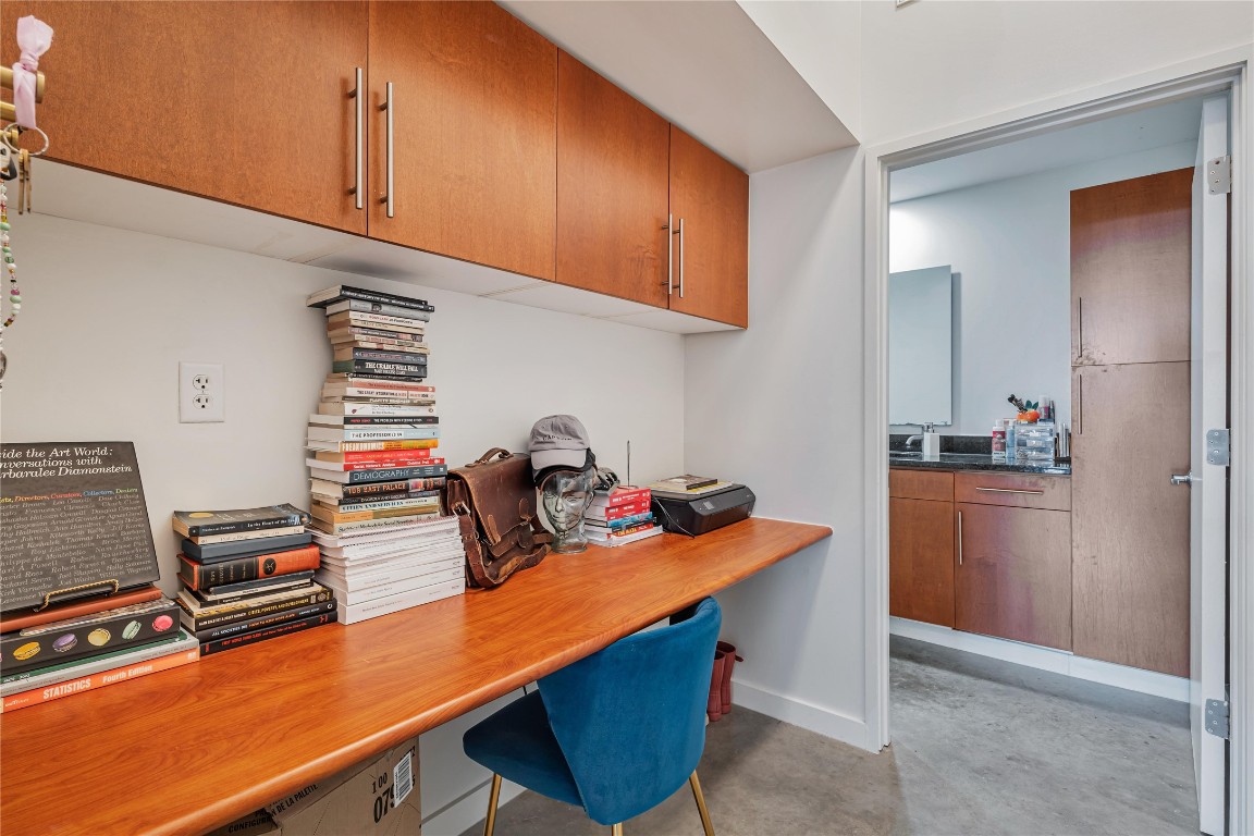 2124 East 6th Street, Unit 305 Austin, TX 78702 - Photo 13 of 35 a room with furniture a refrigerator and a stove