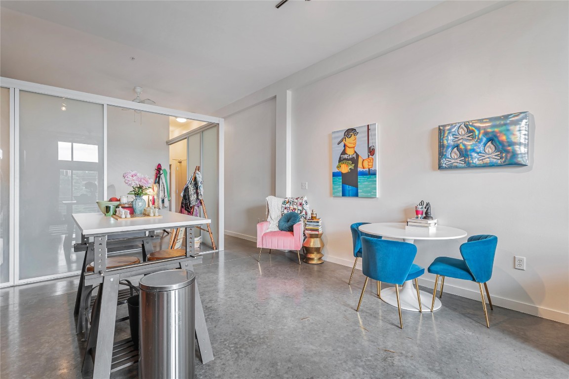 2124 East 6th Street, Unit 305 Austin, TX 78702 - Photo 16 of 35 a living room with furniture and a dining table