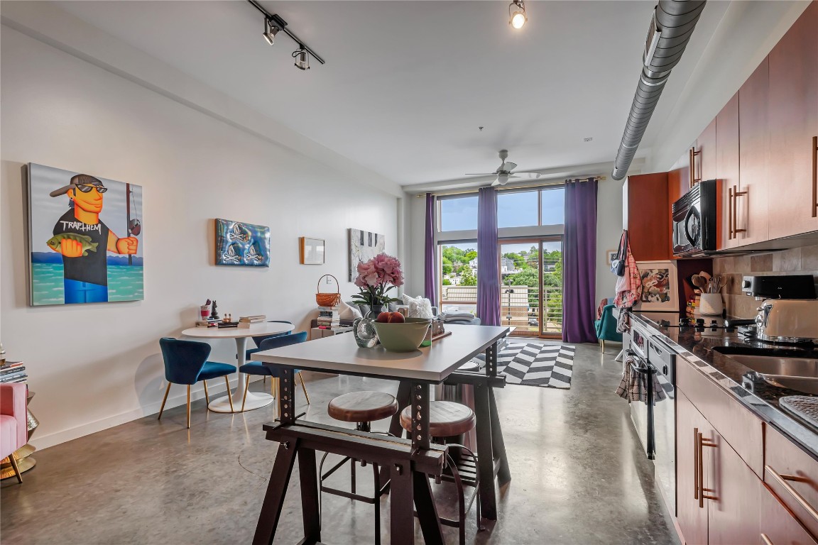 2124 East 6th Street, Unit 305 Austin, TX 78702 - Photo 10 of 35 a view of a dining room with furniture window and outside view