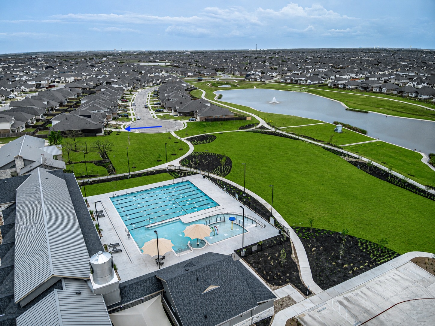 20933 Claire Jean Path Pflugerville, TX 78660 - Photo 22 of 25 View of community: pool, clubhouse and fitness center with home in the distance