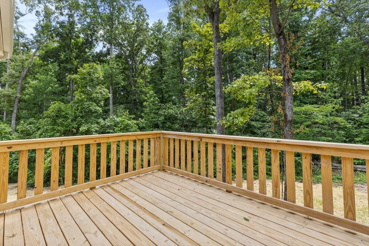 129 County Road 155 Riceville, TN 37370 - Photo 12 of 31 a balcony with wooden floor and fence