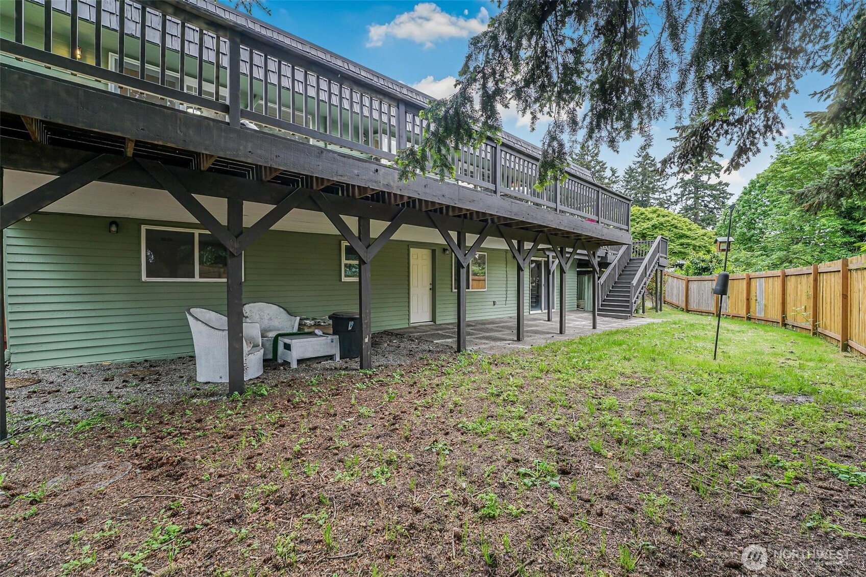 11404 Karshner Road East Edgewood, WA 98372 - Photo 37 of 40 a backyard of a house with table and chairs