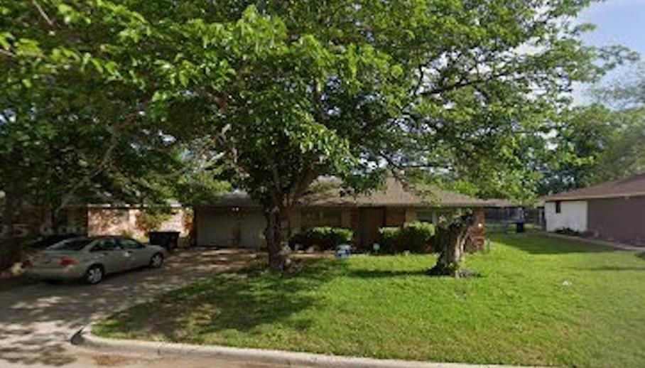 a view of a backyard with a small cabin