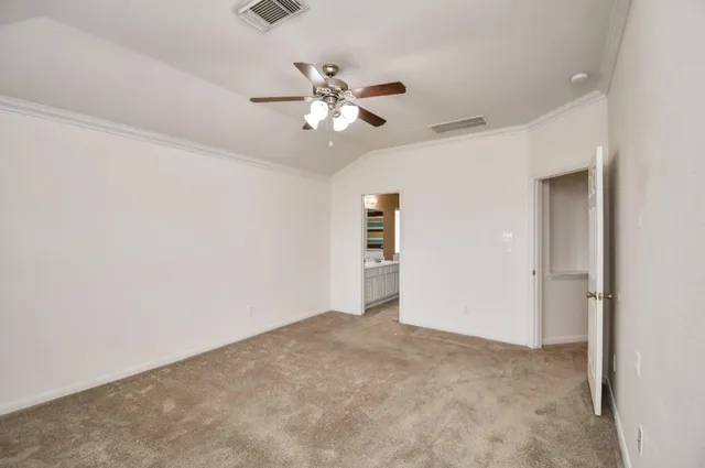 a spacious bathroom with a shower a sink and a mirror