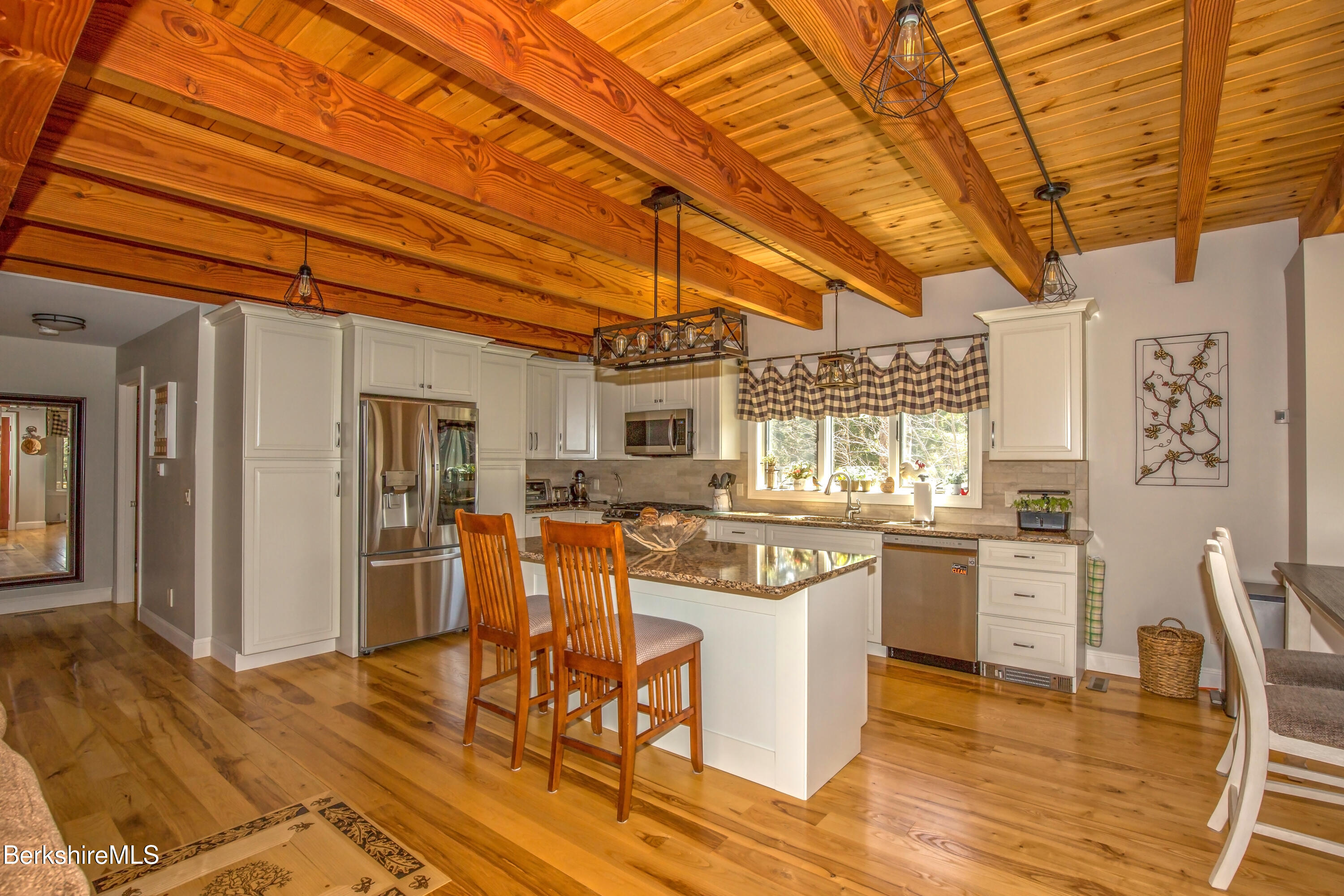 24 Evergreen Drive Otis, MA 01253 - Photo 11 of 41 a open kitchen with stainless steel appliances granite countertop a stove and cabinets with wooden floor