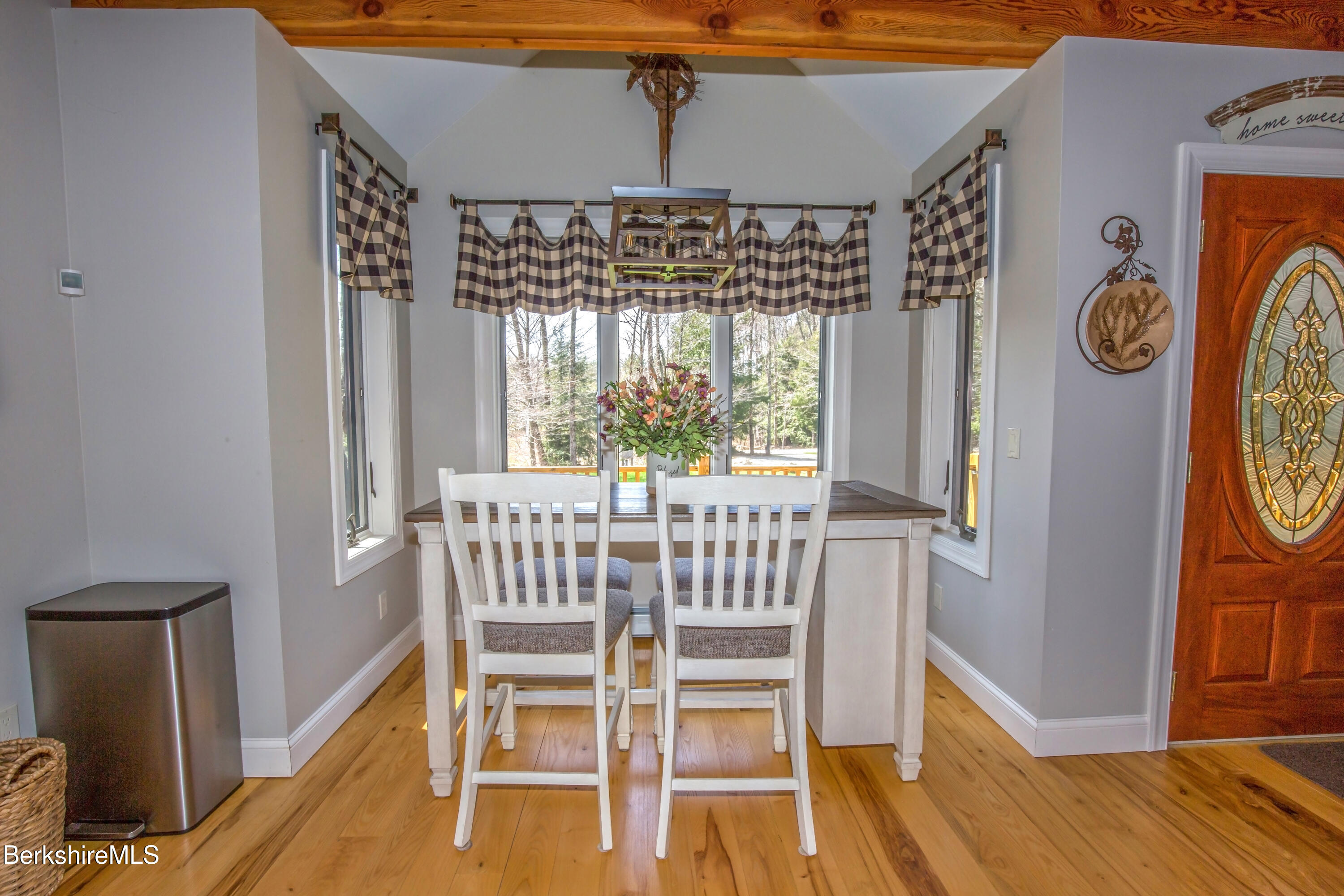 24 Evergreen Drive Otis, MA 01253 - Photo 14 of 41 a view of a dining room with furniture window and wooden floor
