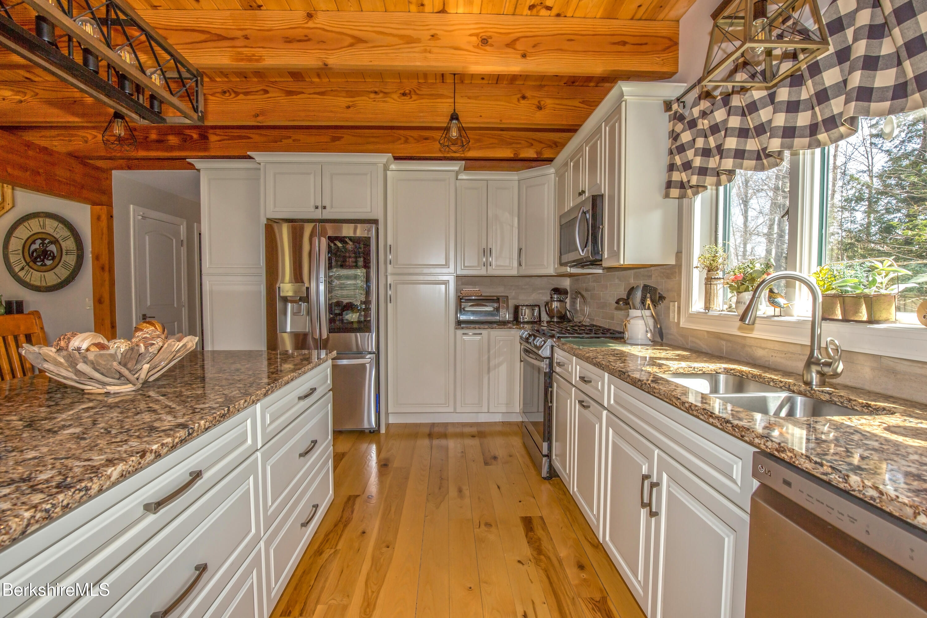 24 Evergreen Drive Otis, MA 01253 - Photo 16 of 41 a kitchen with stainless steel appliances granite countertop a sink and cabinets