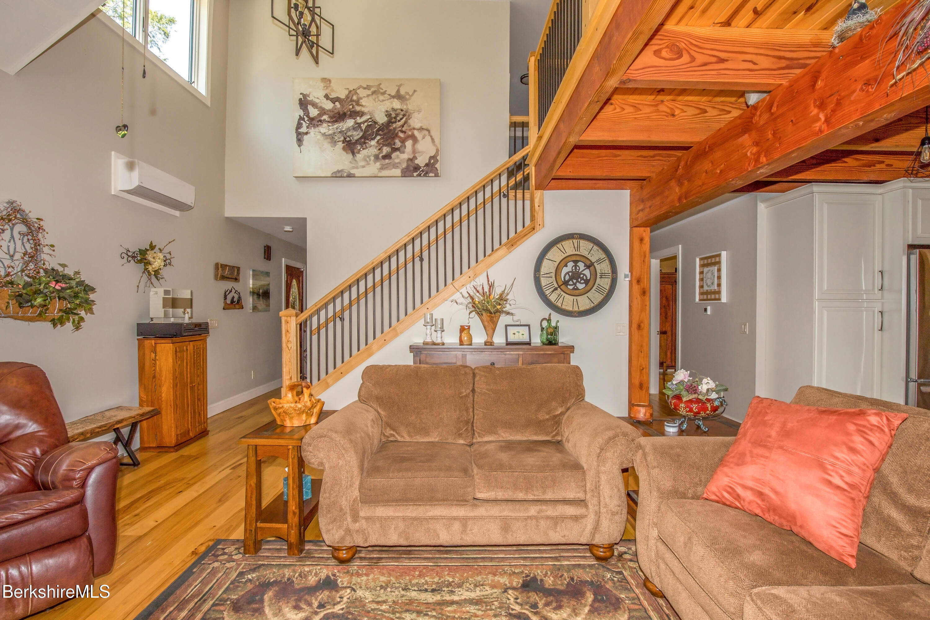 24 Evergreen Drive Otis, MA 01253 - Photo 20 of 41 a living room with furniture and a clock
