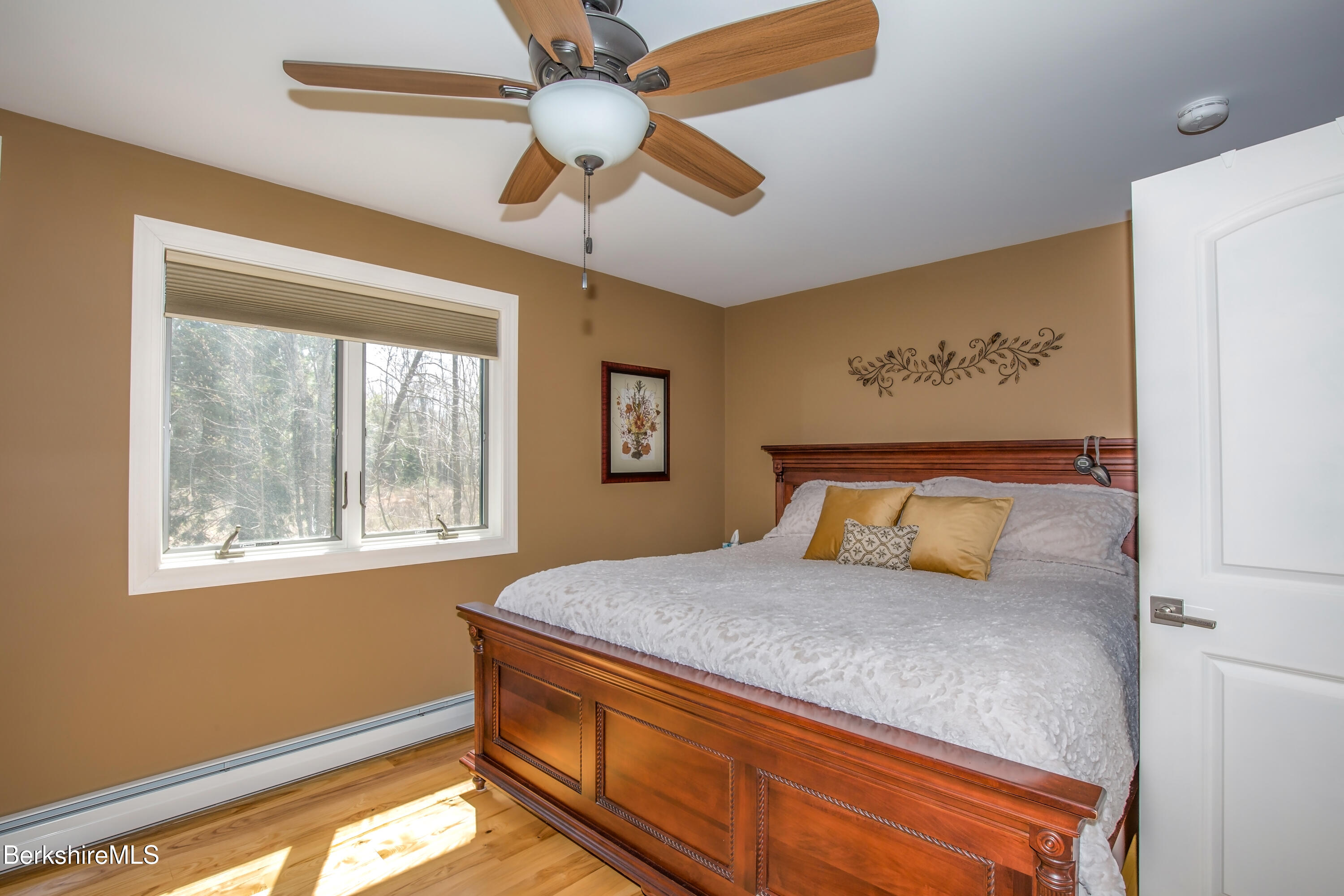 24 Evergreen Drive Otis, MA 01253 - Photo 23 of 41 a bedroom with a bed and a window