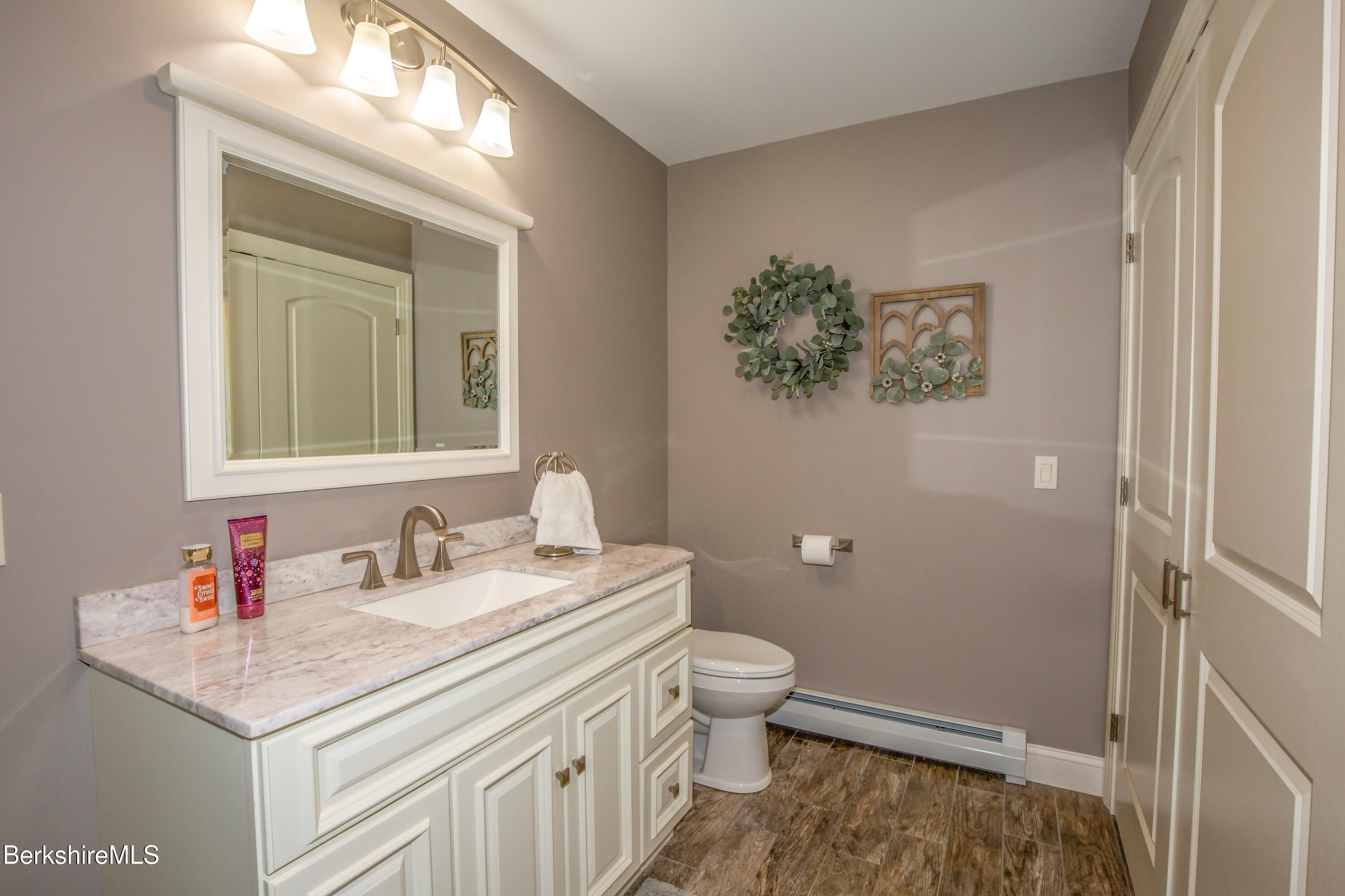 24 Evergreen Drive Otis, MA 01253 - Photo 25 of 41 a bathroom with a toilet sink and mirror