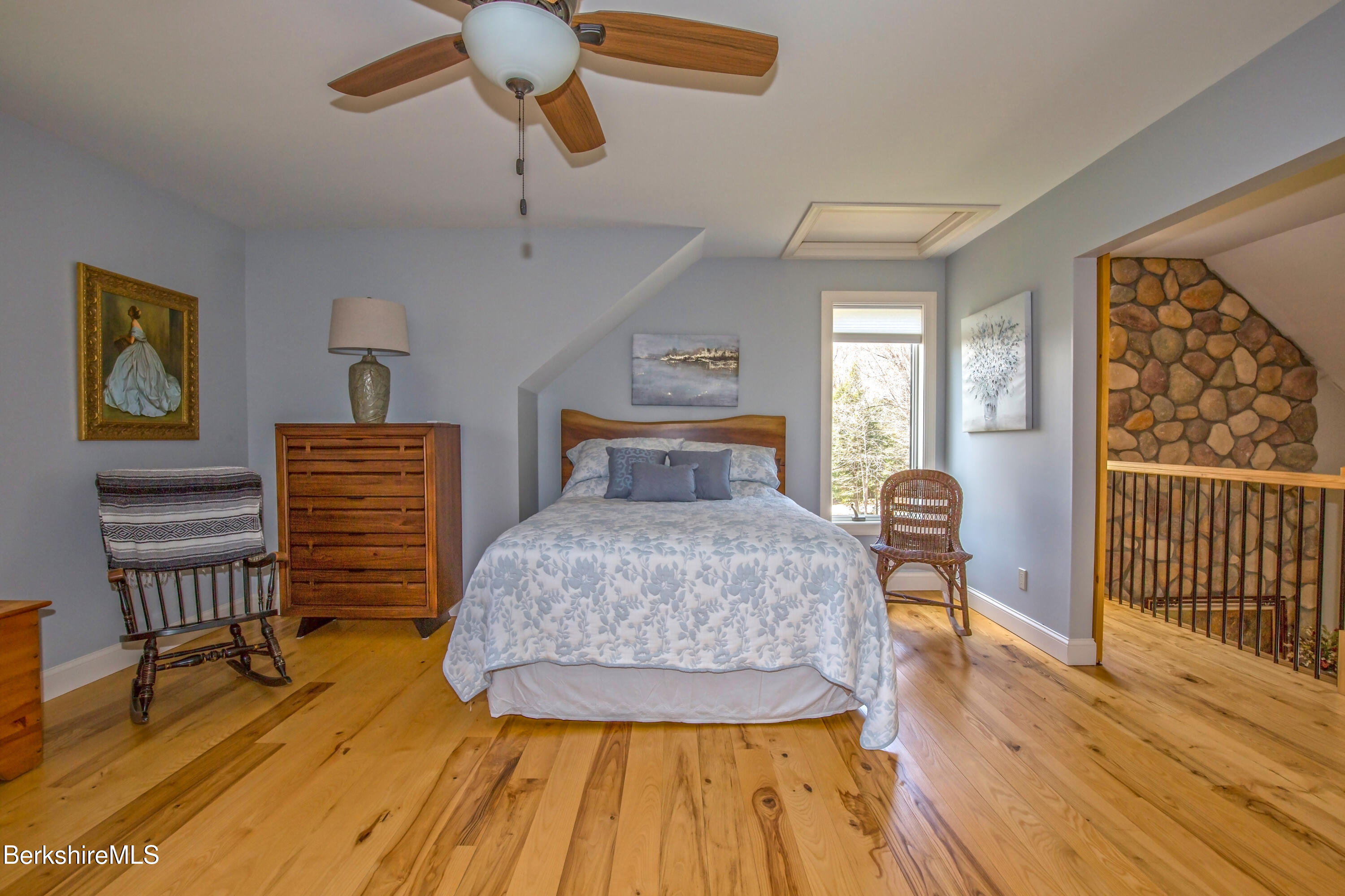 24 Evergreen Drive Otis, MA 01253 - Photo 28 of 41 a bedroom with a bed and wooden floor