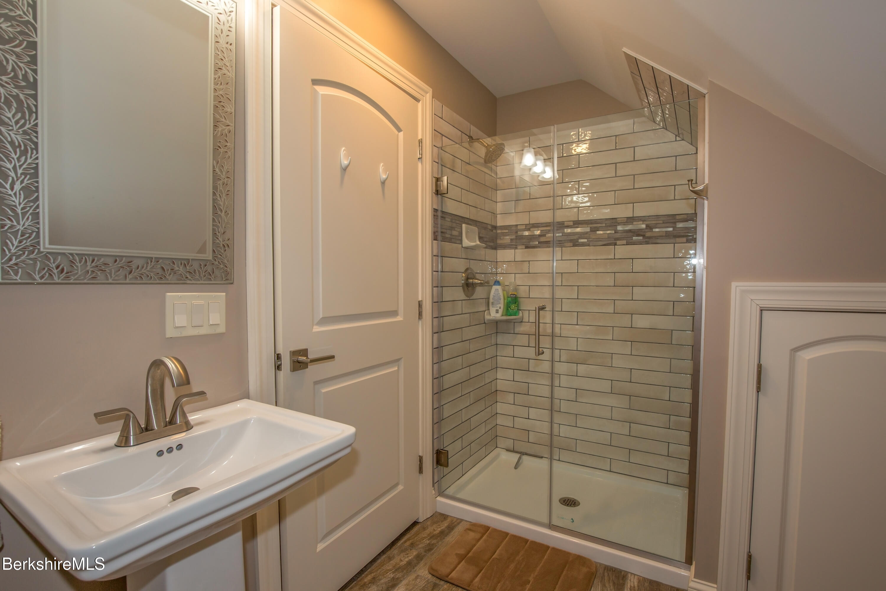 24 Evergreen Drive Otis, MA 01253 - Photo 36 of 41 a bathroom with a shower sink and mirror