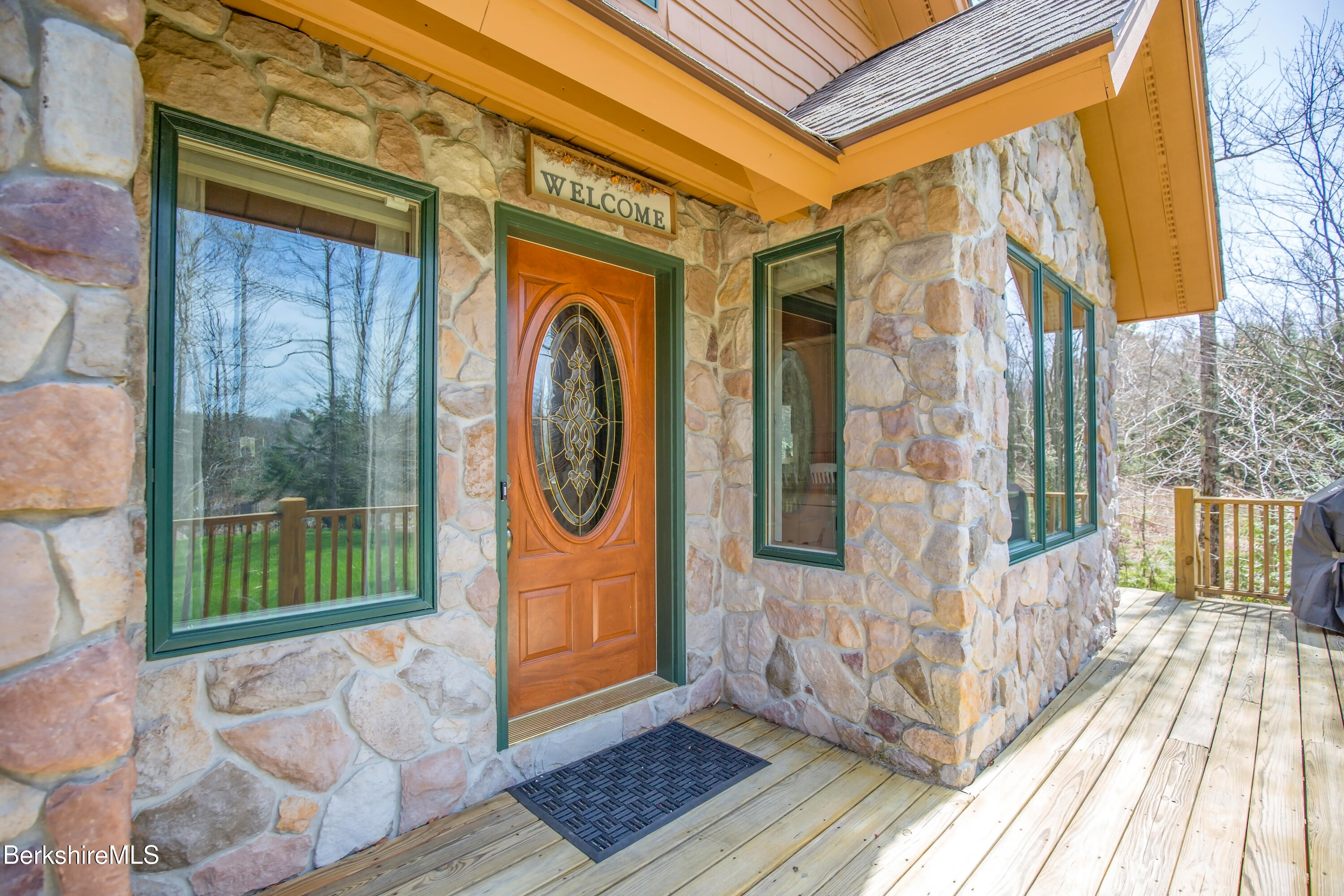24 Evergreen Drive Otis, MA 01253 - Photo 4 of 41 a view of a brick house with a door and wooden floor