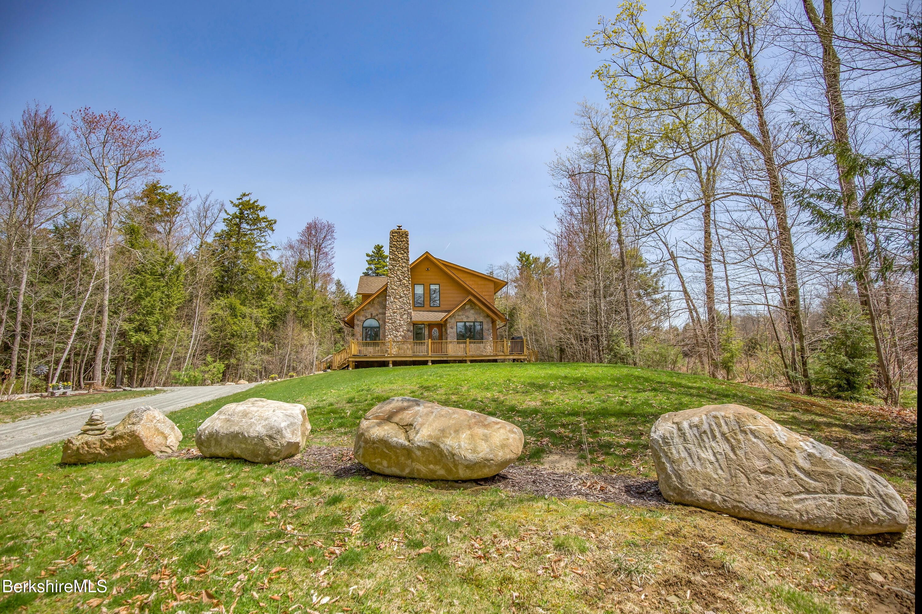 24 Evergreen Drive Otis, MA 01253 - Photo 6 of 41 a view of a backyard with large trees