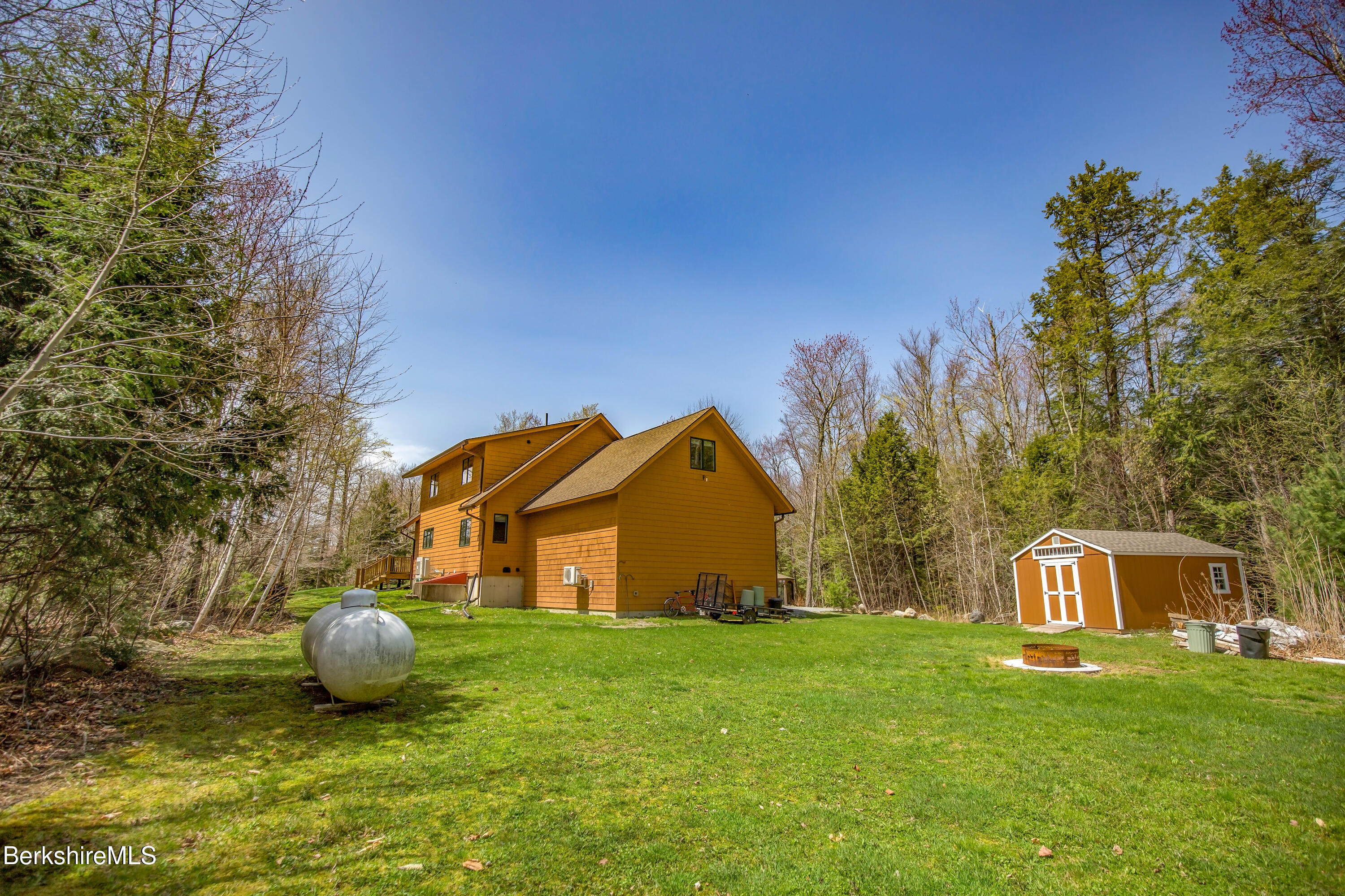 24 Evergreen Drive Otis, MA 01253 - Photo 7 of 41 a view of a house with backyard and trees