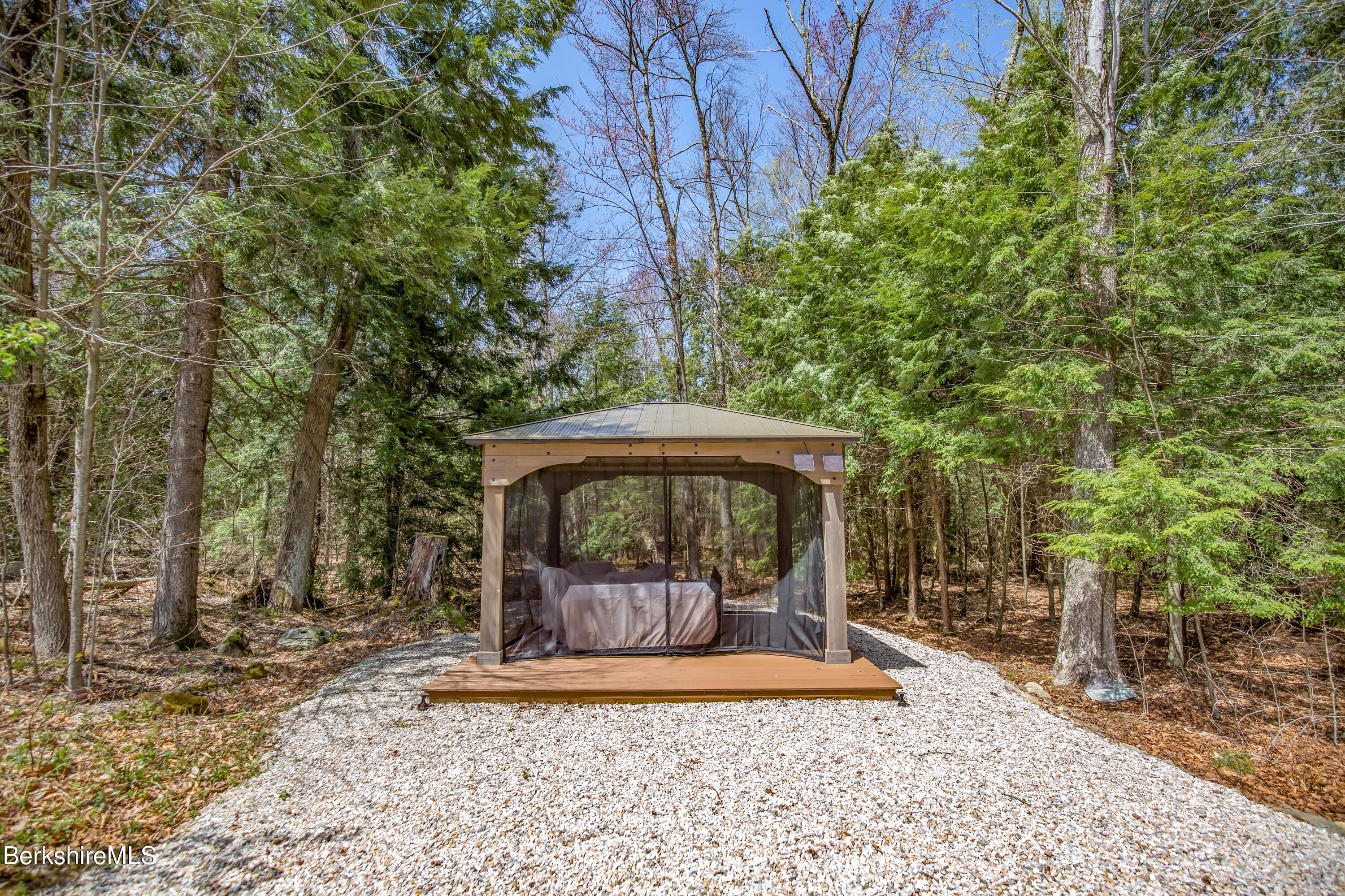 24 Evergreen Drive Otis, MA 01253 - Photo 8 of 41 a view of a bench in the backyard