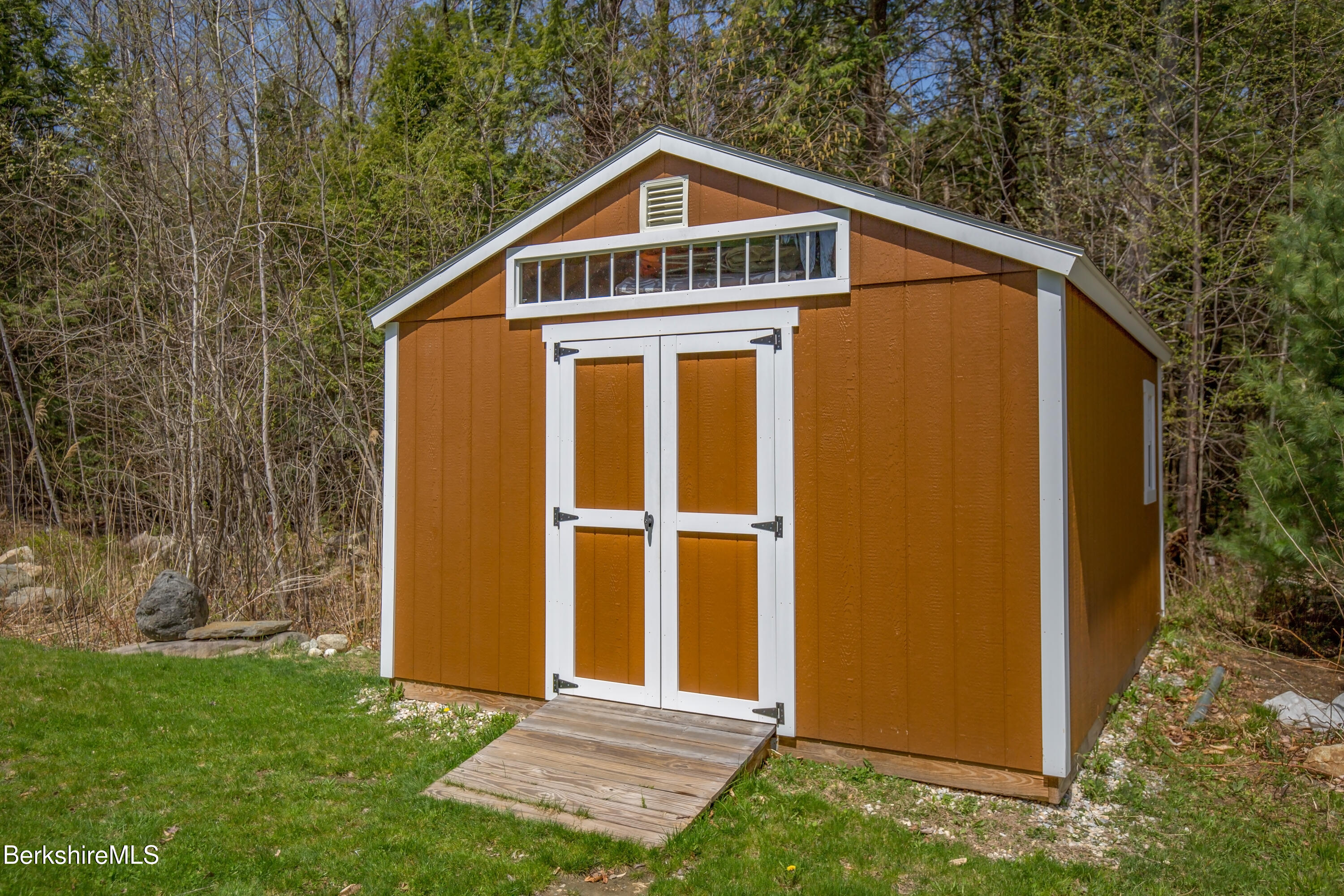 24 Evergreen Drive Otis, MA 01253 - Photo 9 of 41 a front view of a house with a yard