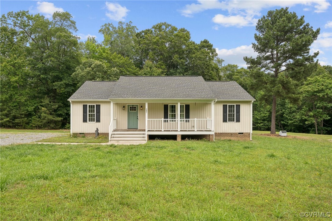 View of front of property with crawl space, covere
