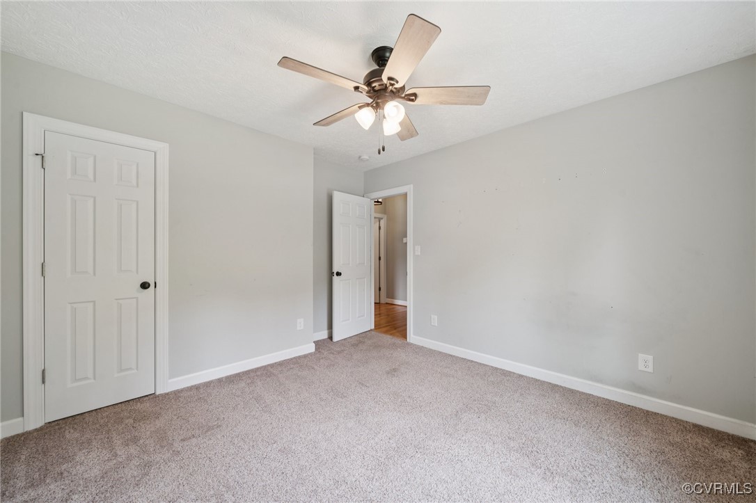 241 Deep Landing Road Tappahannock, VA 22560 - Photo 21 of 33 Unfurnished bedroom featuring carpet floors, baseb