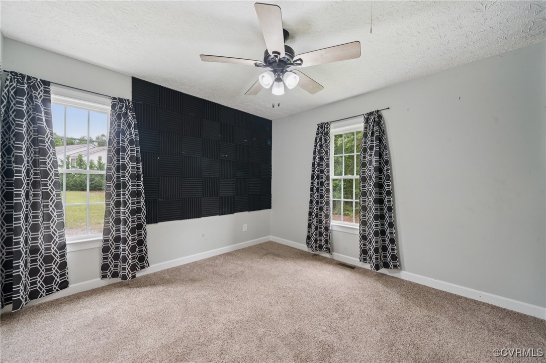 241 Deep Landing Road Tappahannock, VA 22560 - Photo 22 of 33 Empty room featuring carpet floors, healthy amount